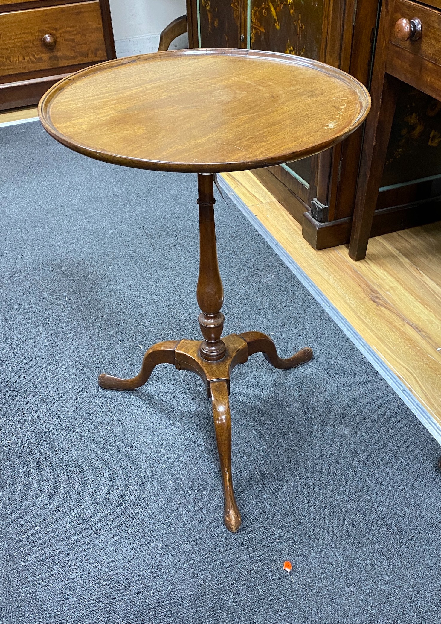 A George III style circular mahogany tripod wine table, diameter 50cm, height 70cm